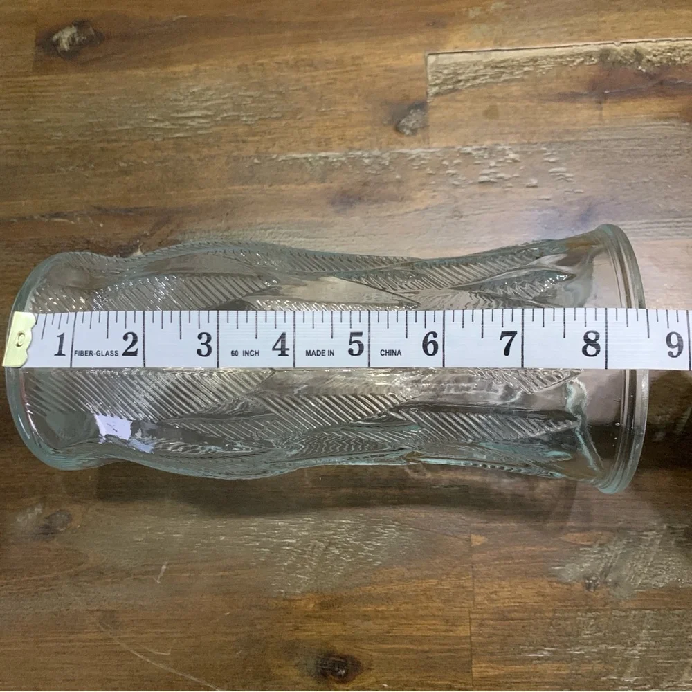 Clear glass floral vase with etched design